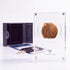 Bronze Masada prutah, amphora obverse, in a display case with gift box, certificate and a packet of crushed Jerusalem stone